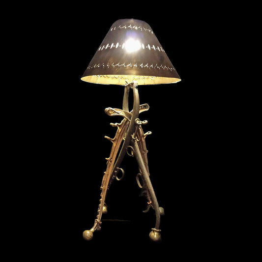 The Rancher antique horse collar lamp on black background