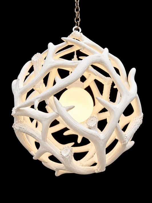 White antler ball chandelier hanging from chain, angled view - Rocky Mountain Antler Works