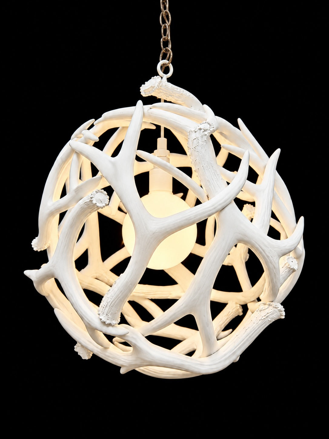 White antler ball chandelier with glowing globe bulb, front view - Rocky Mountain Antler Works