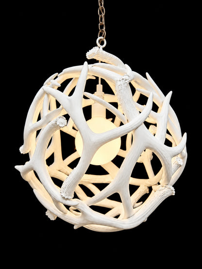 White antler ball chandelier with glowing globe bulb, front view - Rocky Mountain Antler Works