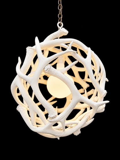 White antler ball chandelier, side view with warm lit interior - Rocky Mountain Antler Works